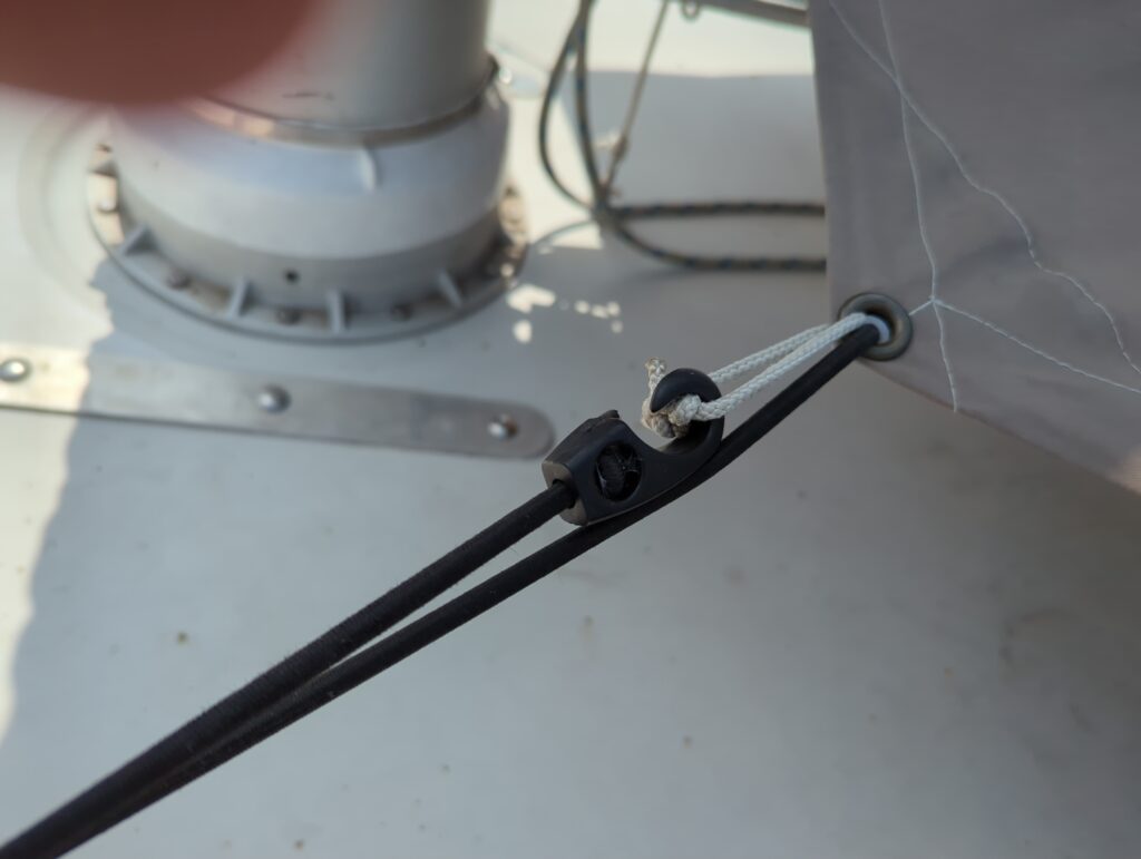 Port forward clip looped around the pulpit and back to the grommet.