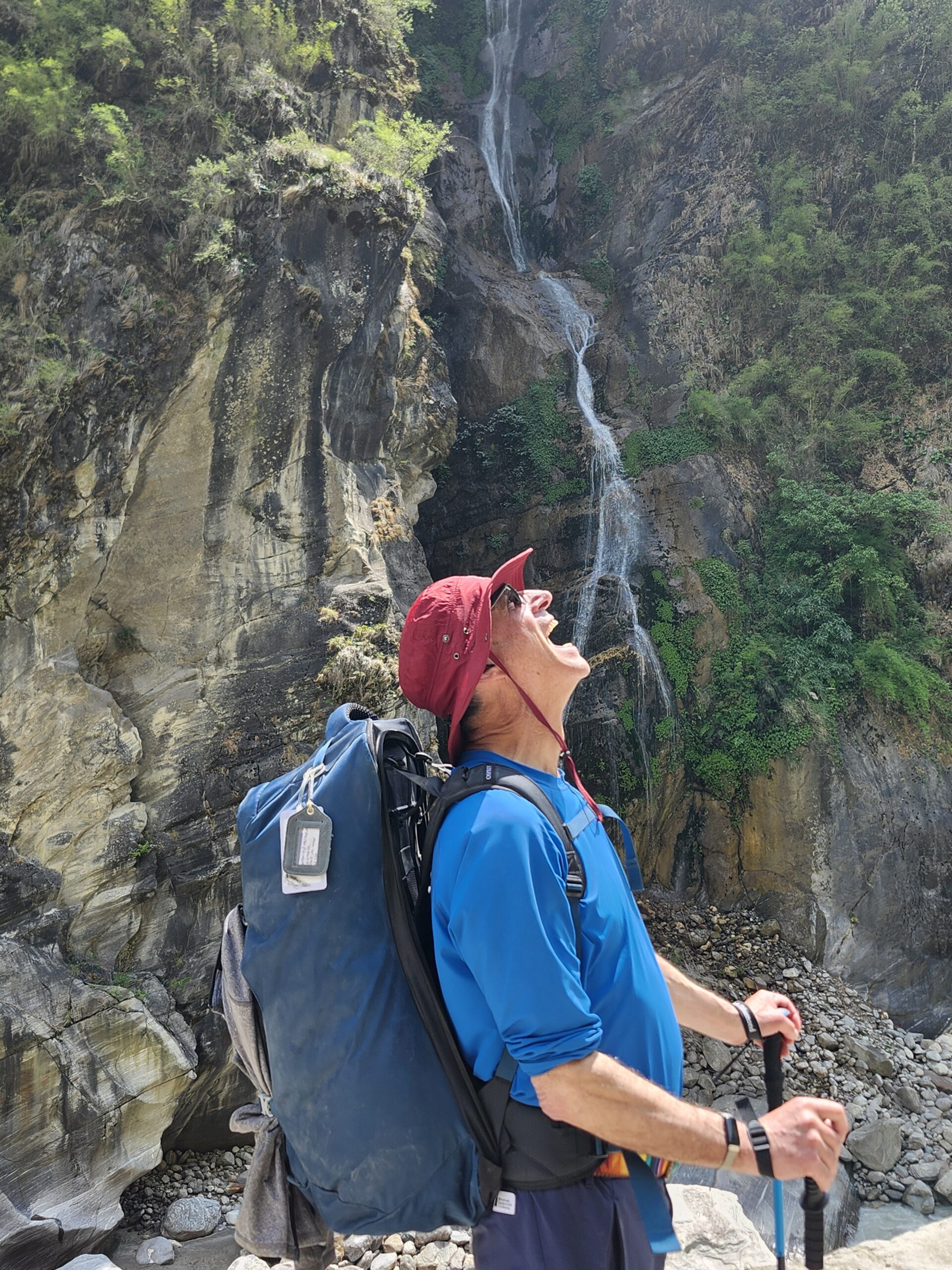 With yet another high waterfall in the background on the other side of the river, we lined up the camera to look as if we are drinking from a little trickle.